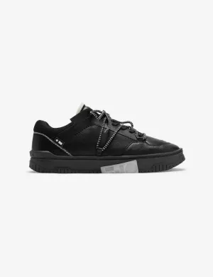 702 triple black low top sneaker